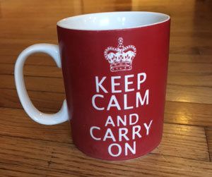 red mug that says keep calm and carry on
