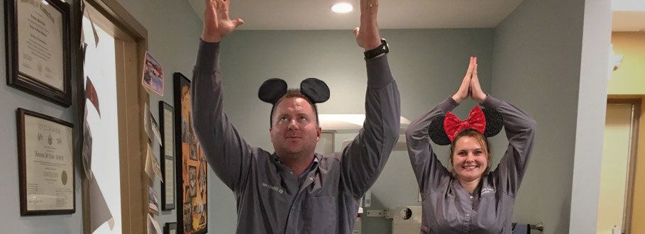 dentists doing yoga poses in mickey mouse ears