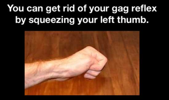 man's left hand squeezing his own thumb