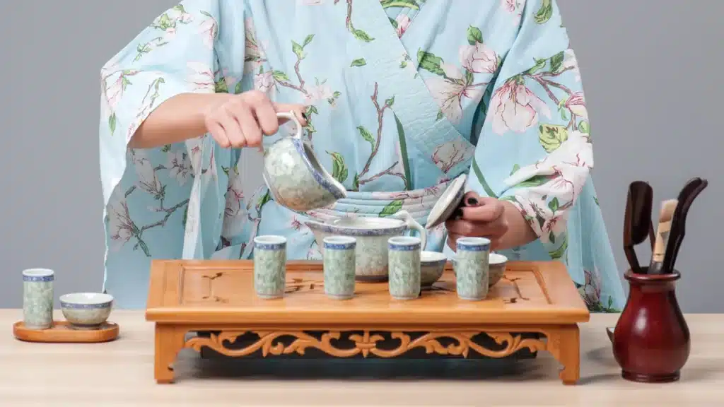 Asian woman pouring tea during a tea ceremony