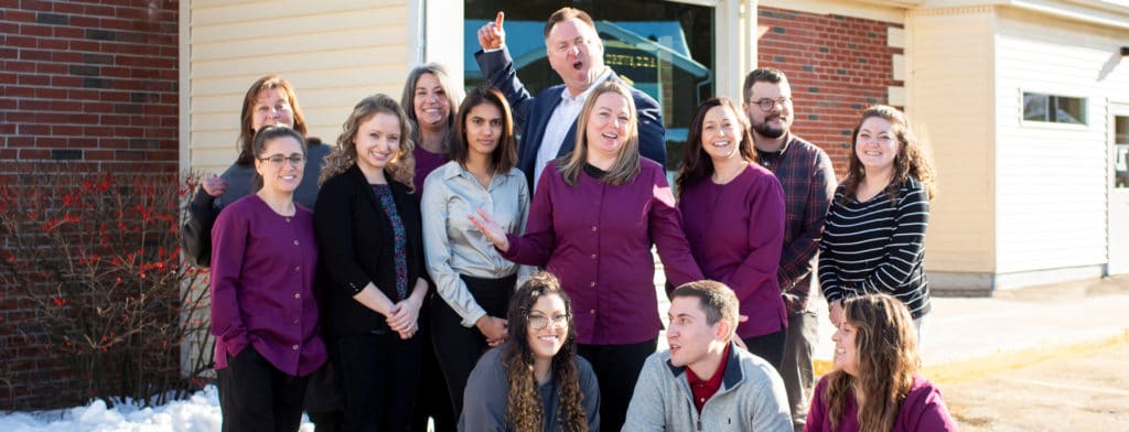 silly team photo of dentists and dental staff at Drews Dental in Lewiston, Maine