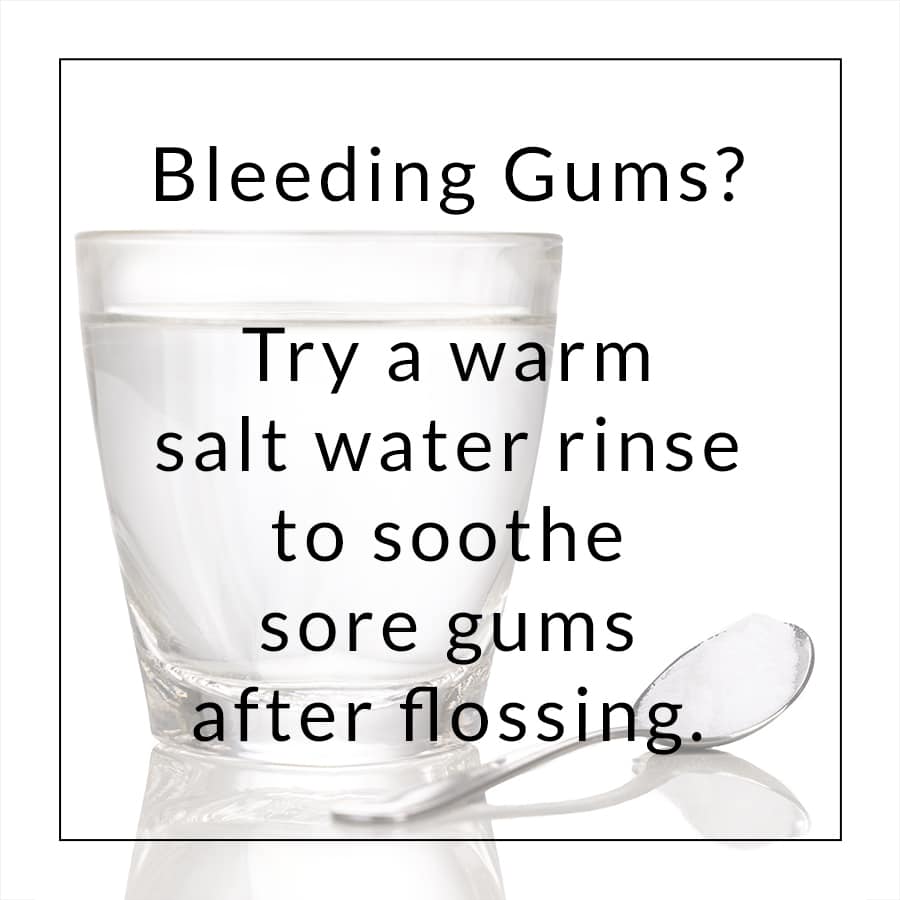 Background photo of a glass of water and a spoon full of salt behind a quote that says Bleeding gums, try a warm salt water rinse to soothe sore gums after flossing.