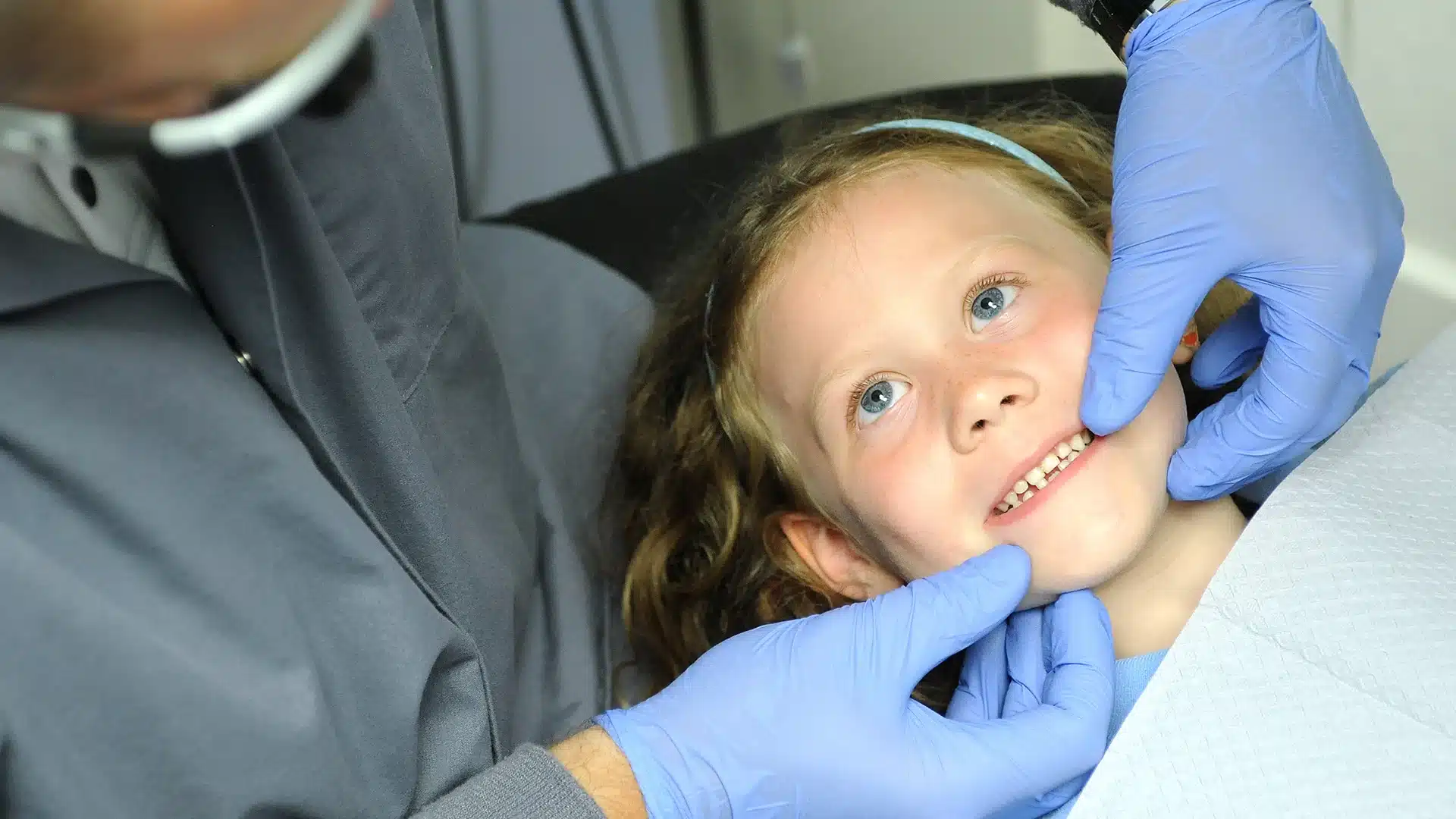 Young girl with Dr. Drews during her dental visit