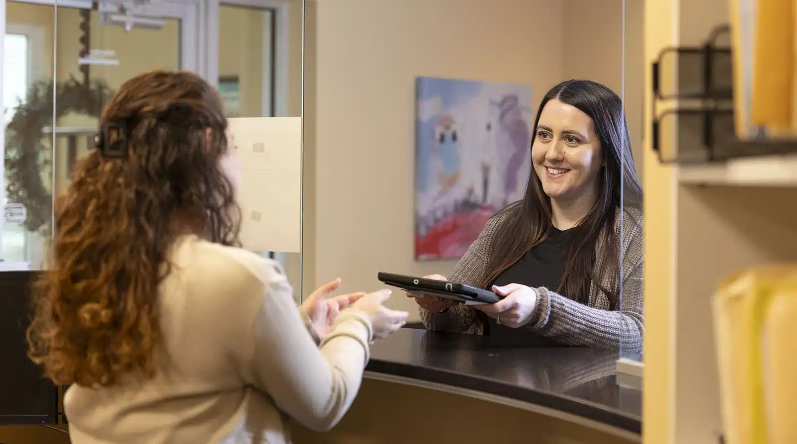 welcoming a new patient at Drews Dental Services in Lewiston, ME