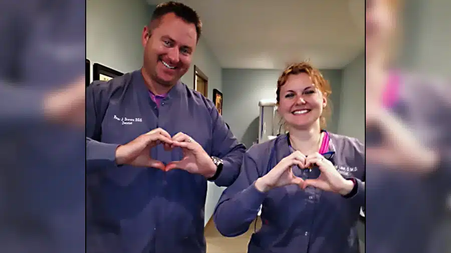dr. drews and dr. lake making hearts with their hands