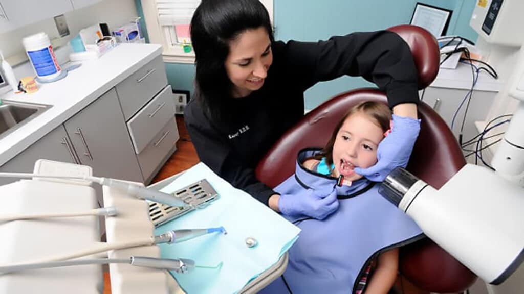 Karey administering x-ray for a pediatric dental patient