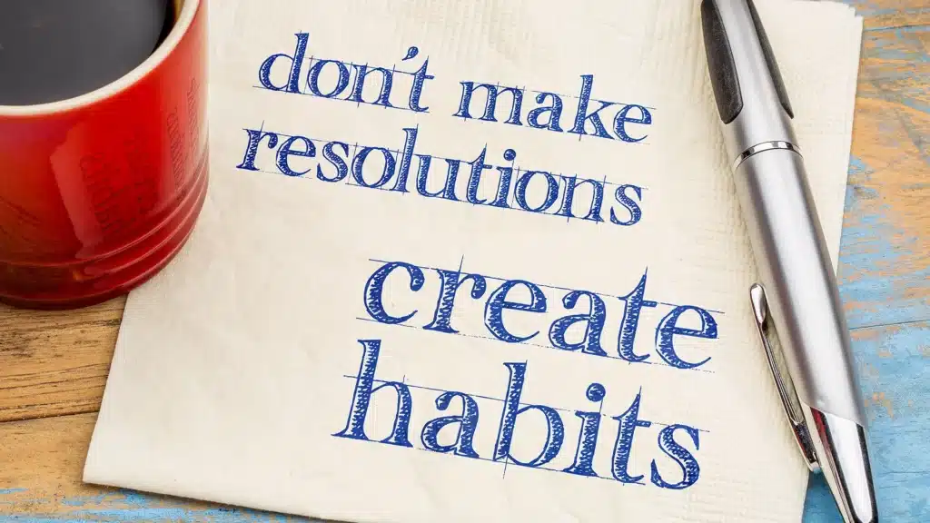 don't make resolutions, create habits scribbled on a napkin laying on a table