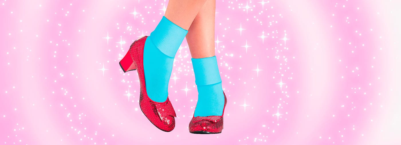 glittery red shoes on a glittery pink background