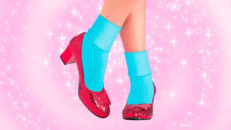 glittery red shoes on a glittery pink background