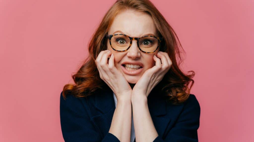 stressed woman clenching her teeth