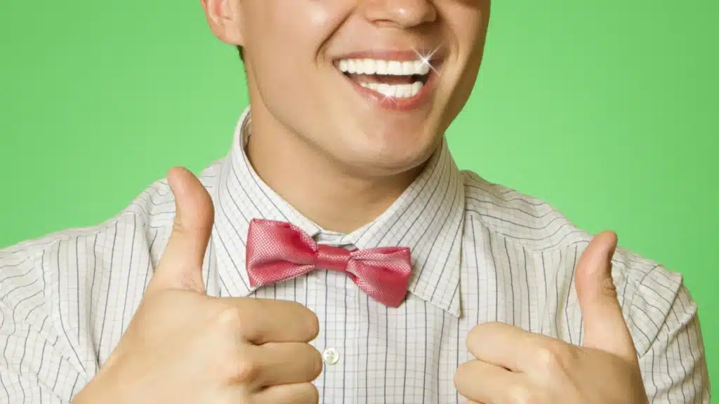 nerd with super bright white teeth