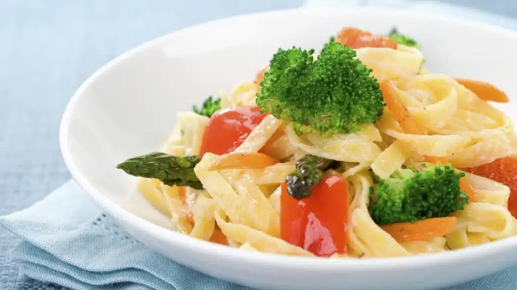 close up of a pasta and veggies dip
